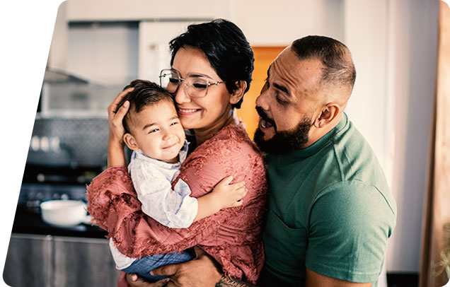 Adults holding a child