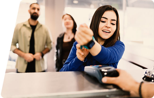Icon of a person making a tap payment with a smart watch