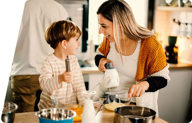 Image of a mother and child baking together in a kitchen