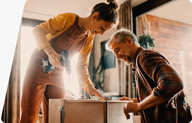 Two people building a table