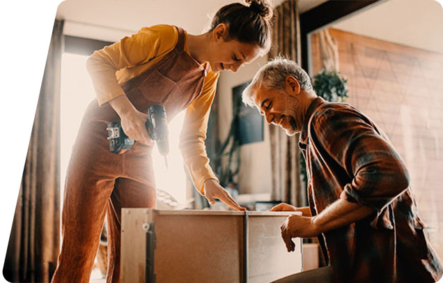Two people building a table