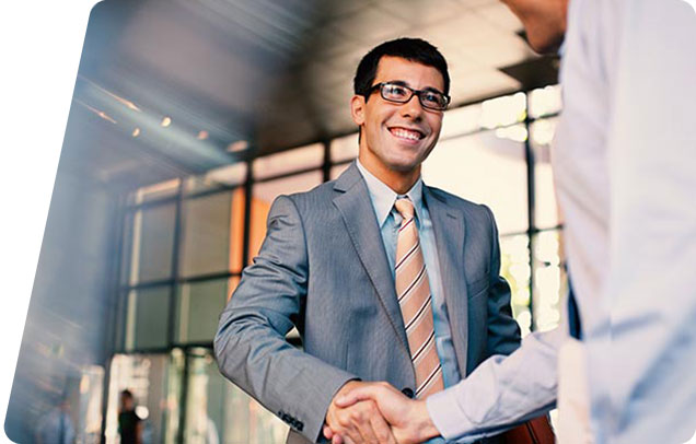 Person shaking hands with another person in office setting.