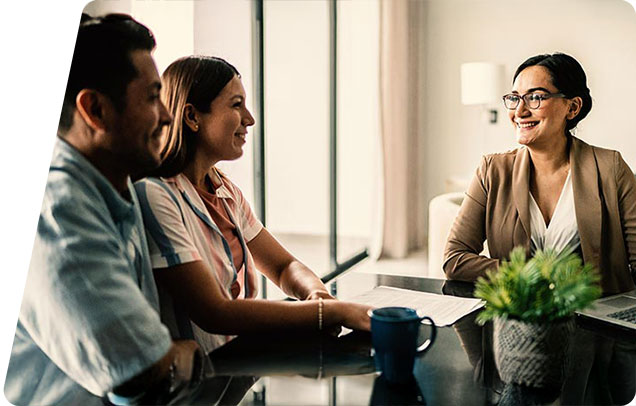 A young couple meets with a mortgage loan advisor