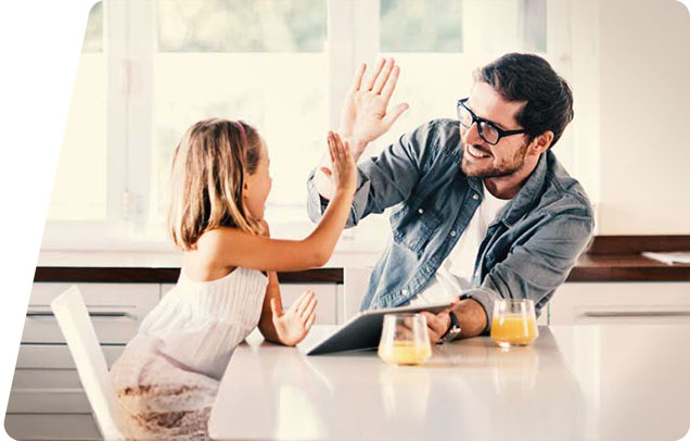 A parent and child high five each other