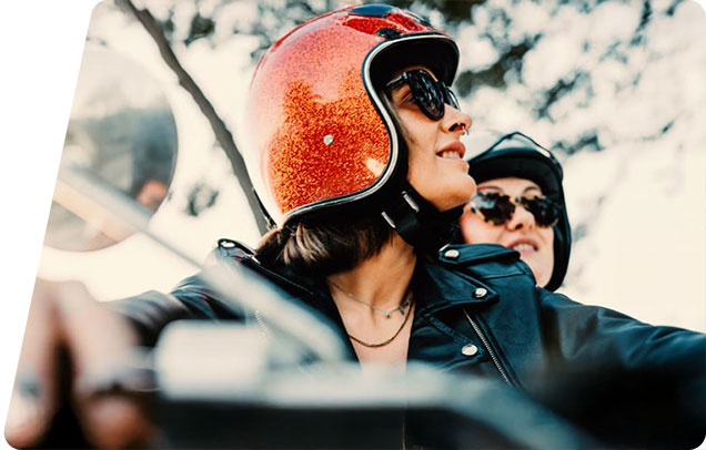two people riding a motorcycle