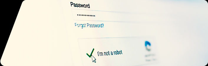 A close-up of a web login form showing a password field with hidden characters, a 'Forgot Password?' link, and a 'I'm not a robot' reCAPTCHA checkbox.