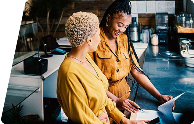 Two people working in a cafe