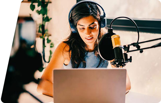 Person recording in a studio with headphones on